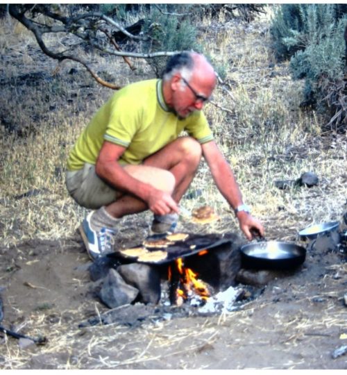 Chuck Leach cooking a group dinner at river camp